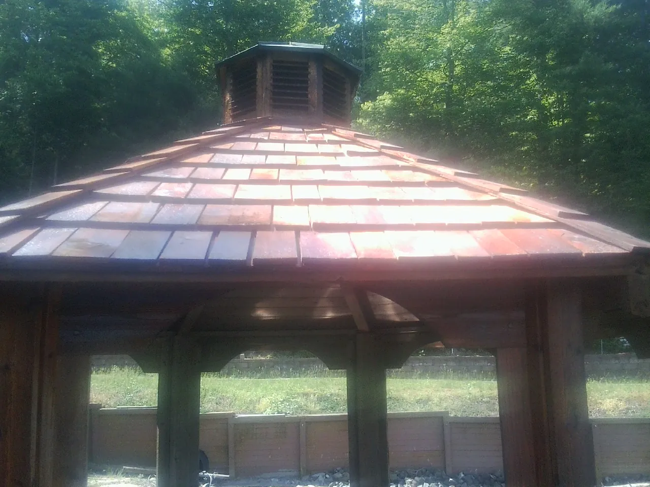 New cedar shake roof and cupola on a lakeside gazebo in Hopkinsville